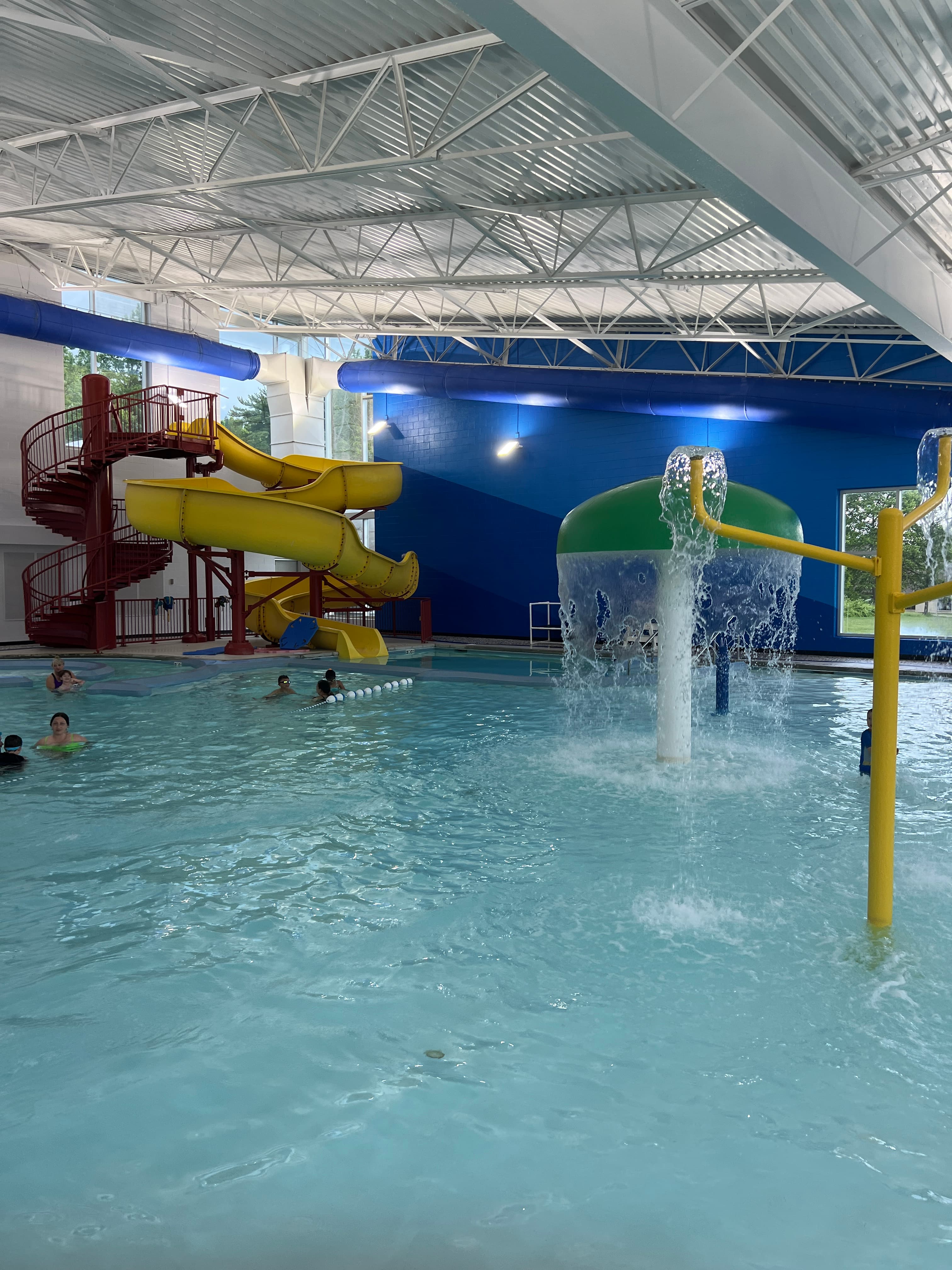 An indoor waterpark. Slides, splash features, zero-entry.